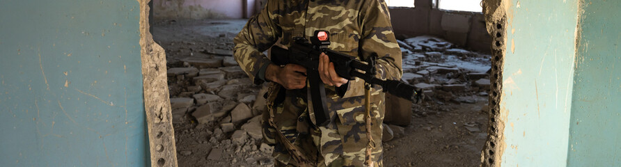 Mercenary in a demolished building, ready to attack