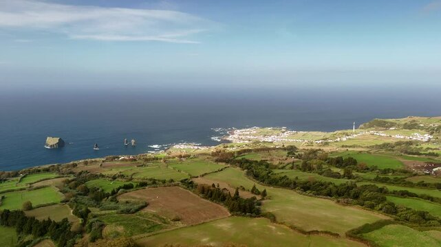 Mosteiros, Azores from a bird's-eye view. The Atlantic Ocean, with its powerful waves crashing against the rugged coastline.
A black sand beach and cliffs, formed from solidified lava, stand as a tes
