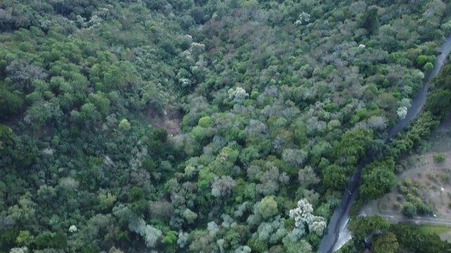 Airplane flying in front of lake Amatitlan and volcanoes at sunset