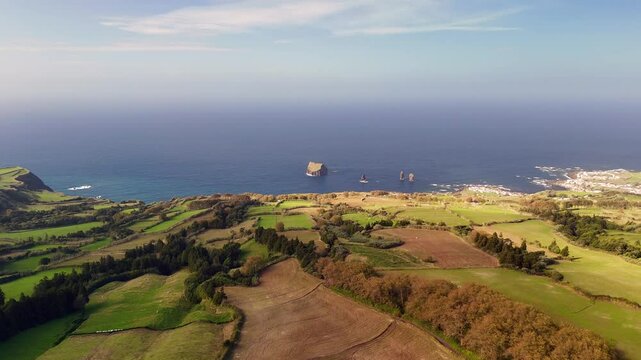 Mosteiros, Azores from a bird's-eye view. The Atlantic Ocean, with its powerful waves crashing against the rugged coastline.
A black sand beach and cliffs, formed from solidified lava, stand as a tes