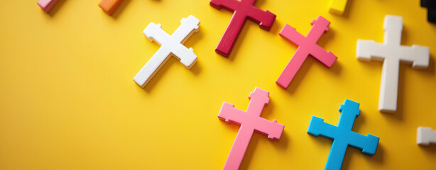 Obraz premium Colorful crosses arranged on bright yellow background create vibrant and modern composition