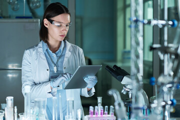 Female Researcher Using Digital Tablet In Lab