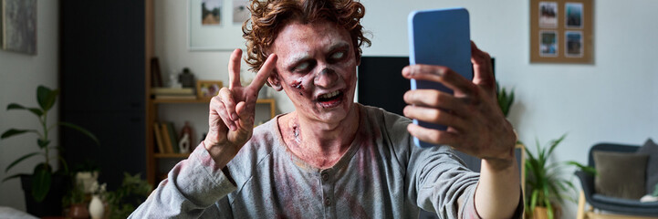 Young Zombie Taking Selfie On Smartphone Header