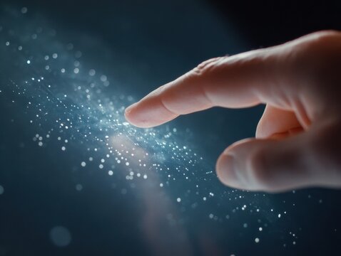 Close-up of hand interacting with futuristic touchscreen technology