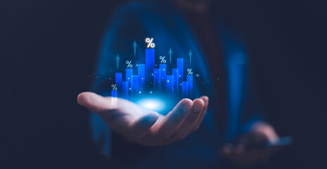 Hand holding graph with percentage, interest rate and dividend concept, income and return on...