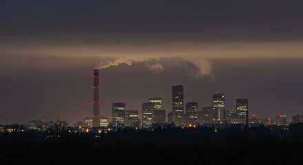 Industrial Smokestacks at Stormy Twilight