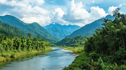Fototapeta premium Serene River Flowing Through Lush Green Mountains under Blue Sky