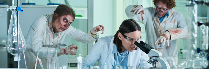 Brave Young Woman Working In Lab Full Of Zombies Header
