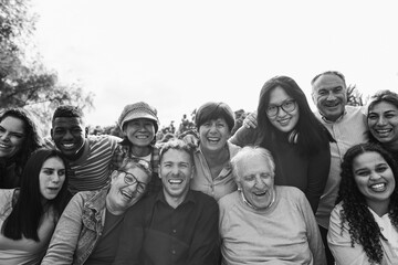 Group of multigenerational people smiling in front of camera - Multiracial friends of different...