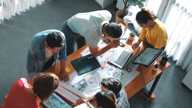 Time lapse of civil engineer team working together to plans building construction. Top view of architect designer walking and joining meeting while talking idea while looking at tablet. Symposium.