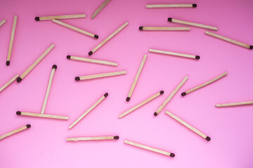International Mat Day. The matches are scattered on a pink background.