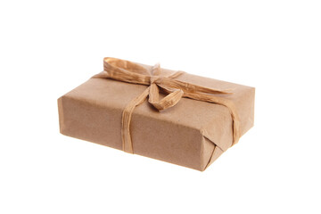 Small rectangular gift box wrapped in brown kraft paper and tied with a rustic twine bow. Minimalist and eco-friendly packaging isolated on a white background