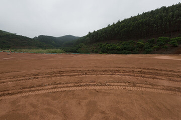 Obraz premium Ruts in the yellow clay surface