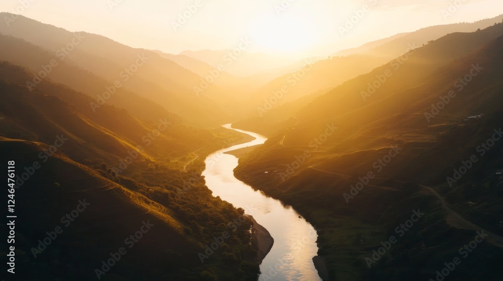 Aufkleber aerial view showcases a vibrant mountain range with glowing twilight hues while a gentle river winds