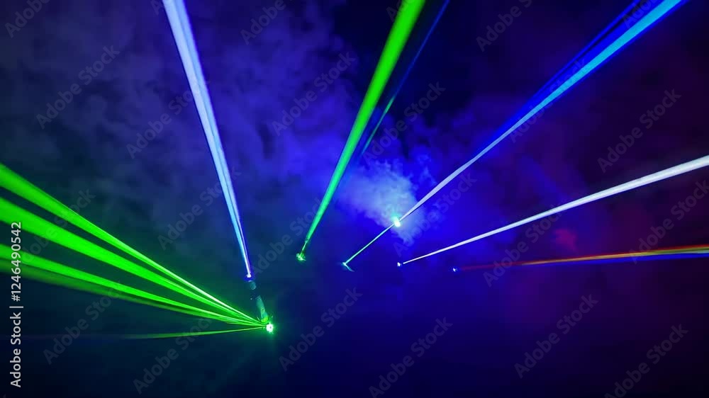 Leinwandbilder laser light display creates mesmerizing patterns in colorful smoke at nighttime event