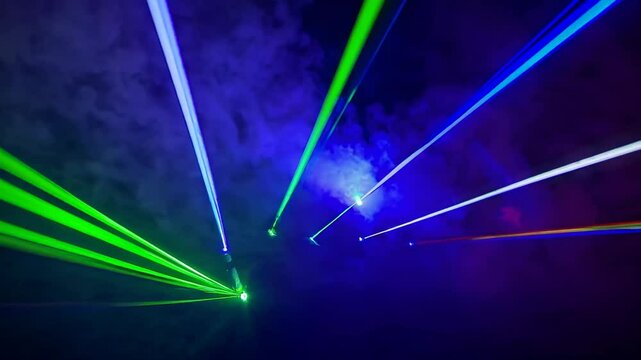 Laser light display creates mesmerizing patterns in colorful smoke at nighttime event