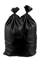 Black Plastic Garbage Bags. Four Large Bags Tied At The Top, Perfect For Household Waste, Featuring A Strong And Durable Material. Isolated on white background.