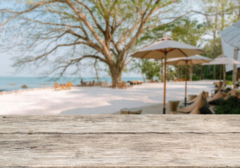Wooden table top on the beach or sea.Party on the beach  daytime concept.For montage product display or design key visual layout.View of copy space.
