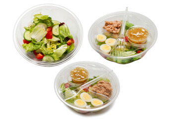 Salad with fresh vegetables isolated on a white background.