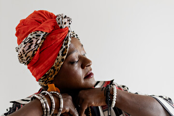 Beautiful woman in African clothes happy on a white background. Smiling, serious. Rio de Janeiro,...