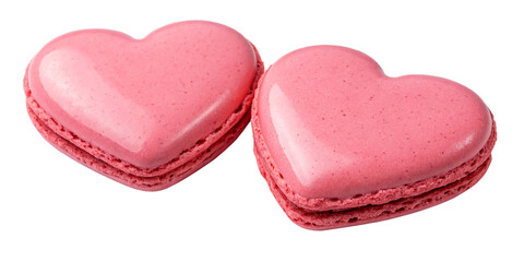 Two pink heart-shaped macarons with a smooth, delicate shell and a creamy filling, isolated on a transparent background.