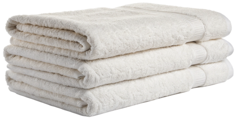 A stacked pile of soft, fluffy white towels neatly arranged, showcasing their plush texture and cleanliness.