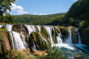 Fototapeta premium Una River, Waterfall in Strbacki buk on summer day, Una river. Bosnia and Herzegovina.