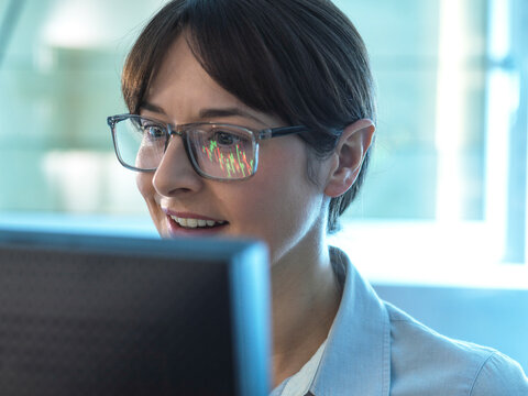 Financial analyst viewing stock market performance of a company share price.
