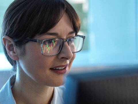 Financial analyst viewing stock market performance of a company share price.