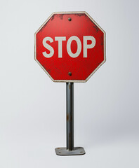Obraz premium Stop sign with bold red octagonal design and white text, widely recognized as a universal traffic safety signal for drivers and pedestrians worldwide.