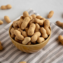 Organic Raw Peanuts in a Bowl, side view.