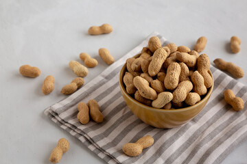 Organic Raw Peanuts in a Bowl, side view.