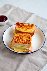 Homemade French Monte Cristo Sandwich with Raspberry Jam, side view.