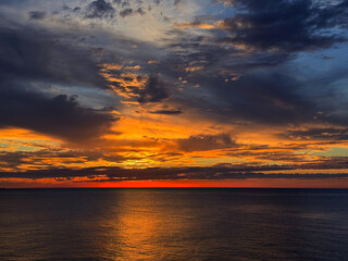 Night sea and sunset heaven clouds horizon.
