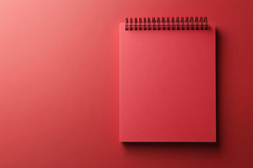 Red spiral mockup calendar with blank page on red background, with copy space for text, logo, ad. Design banner for marketing promo dates and campaigns