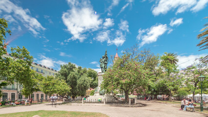 Fototapeta premium Aerial drone view of people relaxing at Dom Luis Garden in the Baixa District of Lisbon, Portugal on a warm spring day with surrounding urban cityscape in the background
