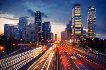 Fototapeta premium Top view traffic jams in big city at night. Royalty high-quality free best stock of city street with multiple lanes filled with cars, all stopped, moving slowly due to traffic congestion in twilight