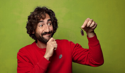 young adult bearded man. cockroach concept
