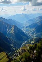 Obraz premium A breathtaking view of sunlit mountains beneath an endless blue sky.