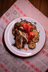 Restaurant dish fish with vegetables: zucchini, pepper