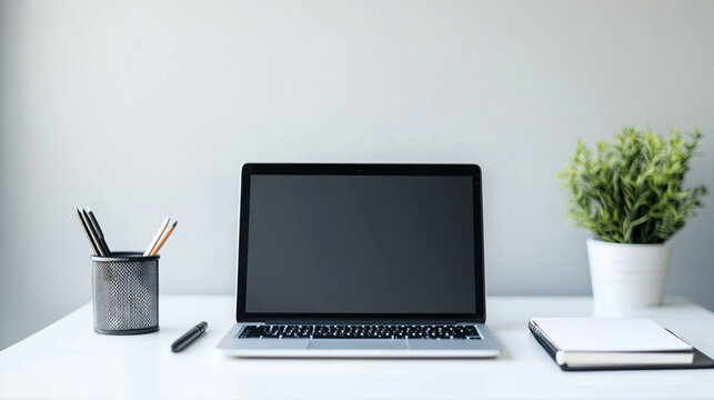 Minimalist workspace setup with open laptop on clean white desk, modern business productivity concept for remote work and professional efficiency