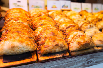 Freshly baked empanadas with different fillings for eating