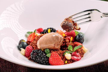 Portion of gourmet dessert with mousse and assorted berries