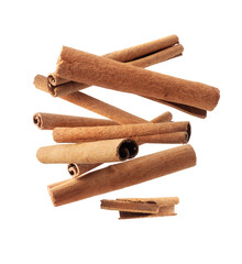 Cinnamon sticks in the air close up on a transparent background