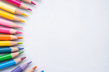Fototapeta premium A vibrant arrangement of colored pencils on a blank surface, perfect for artistic creativity and expression.