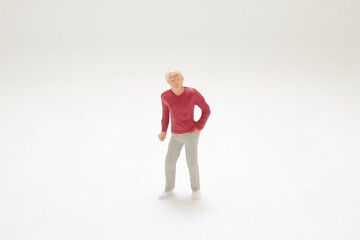 Small Figurine of Man in Casual Attire Isolated