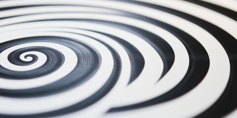 Obraz premium A black and white background with a series of concentric circles, each one softer than the last. The hypnotic effect of this design is perfect for web backgrounds, creative designs, or calming product