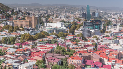Cityscape panorama with glass tower of hotel in Tbilisi aerial timelapse, skyscrapers of Georgia