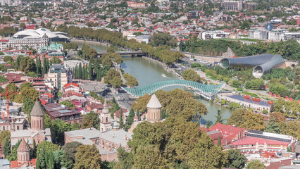 Aerial timelapse of the Bridge of Peace, a bow-shaped pedestrian bridge in Tbilisi, Georgia © HyperlapsePro