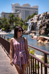 Young woman sightseeing in Las Vegas and visiting the impressive hotels and casinos.